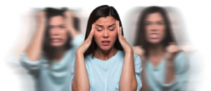 a woman is in the foreground with her eyes closed and her hands to her temples very concerned look to her face, on the background two blurred versions of herself one is pulling her hair and the other one has tight fists and and a very angry look to her face